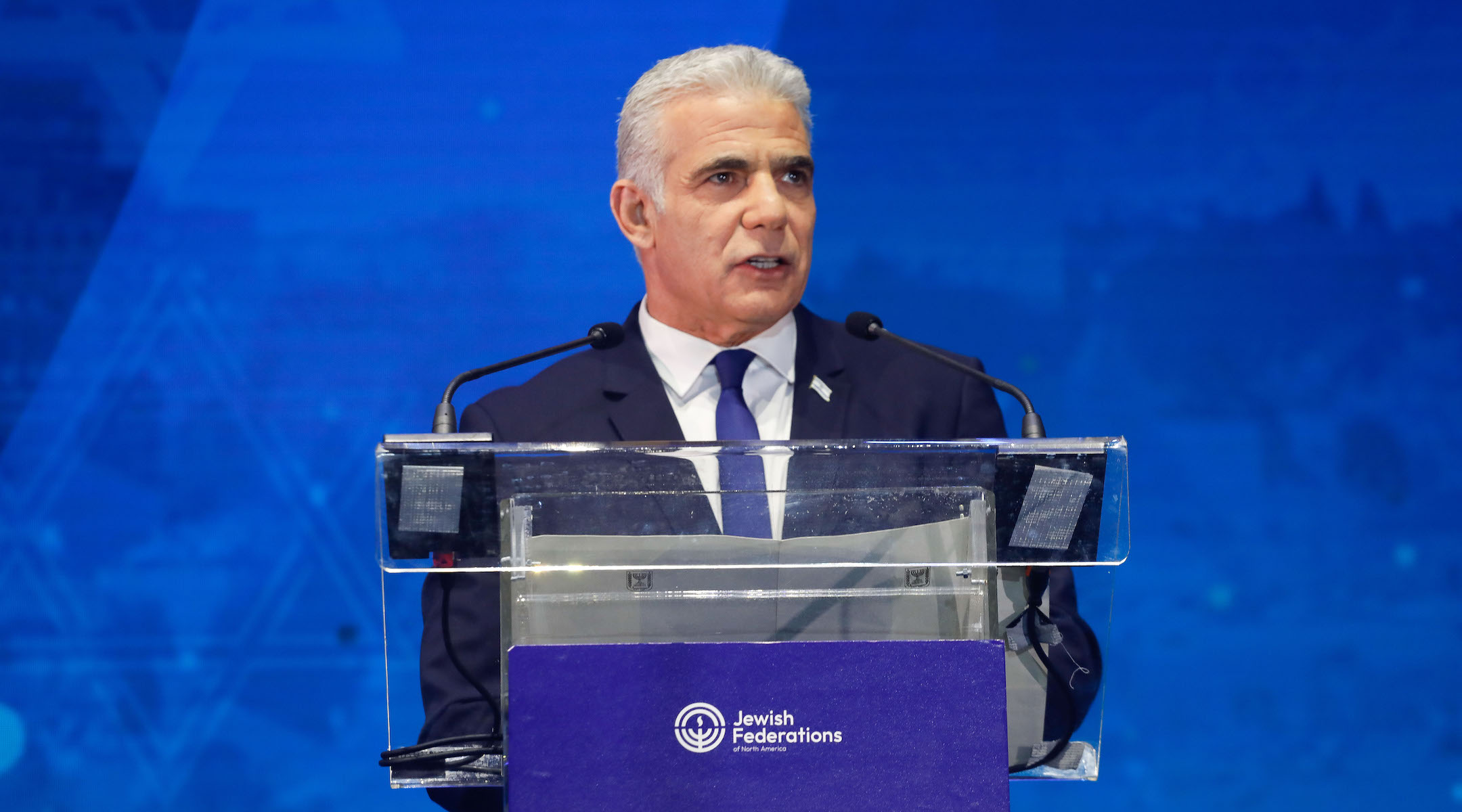 Former Israeli Prime Minister Yair Lapid speaks at the Jewish Federations of North America General Assembly in Tel Aviv on April 24, 2023. (Courtesy of JFNA/Amnon Gutman)