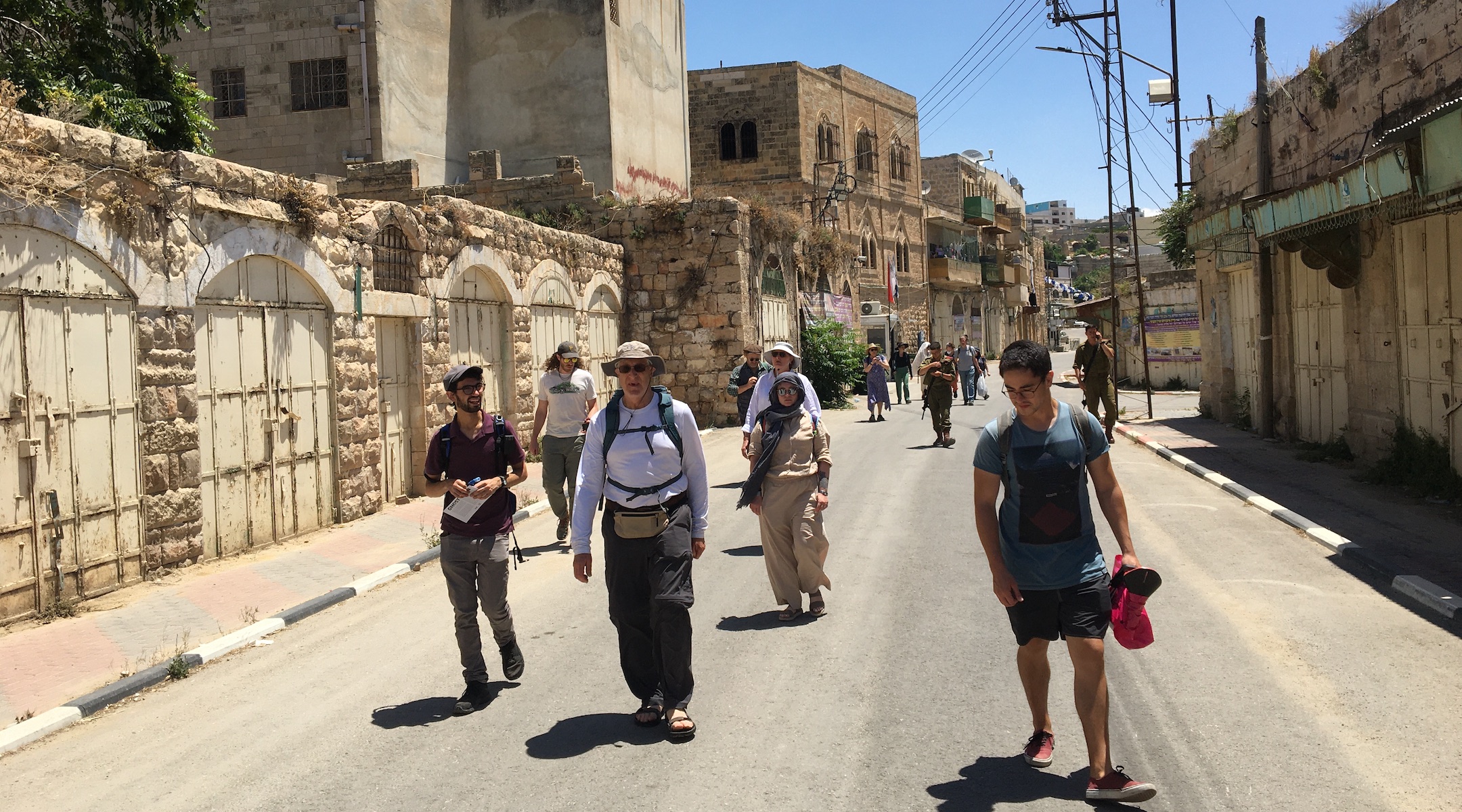 Participants on a recent tour of Israel and the West Bank, which included members of Pittsburgh's Congregation Dor Hadash, walk through Hebron. (Courtesy of Shleimut)
