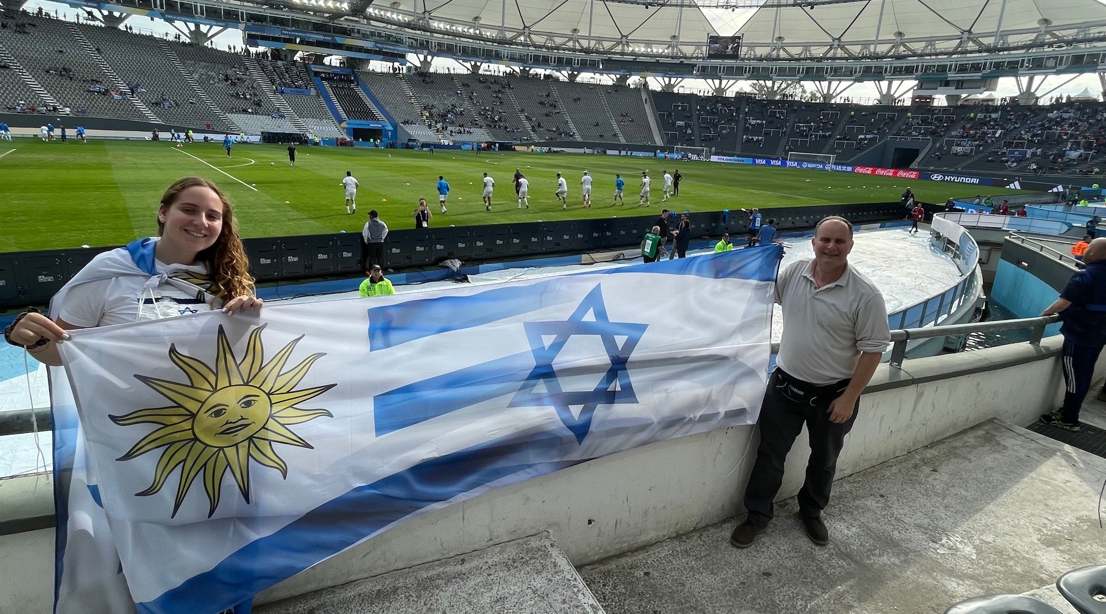 Fans show a banner with the Uruguayan and Israeli flags. Some Uruguayan Jews went into the match torn over who to root for. (Juan Melamed)