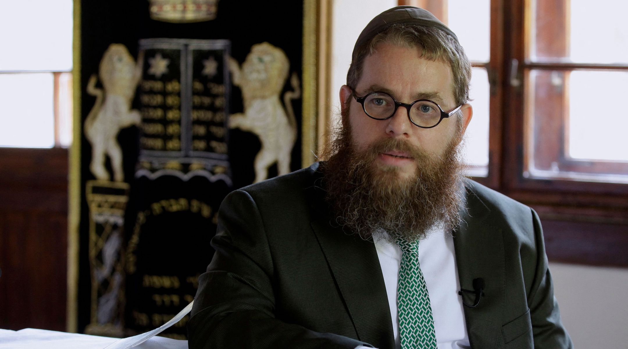 Rabbi Slomo Koves, head of the EMIH (Association of Hungarian Jewish Communities), a group affiliated with the Orthodox Hasidic Chabad-Lubavitch movement, speaks during an AFP interview in Balatonoszod, July 29, 2022. (Peter KohalmI/AFP via Getty Images)