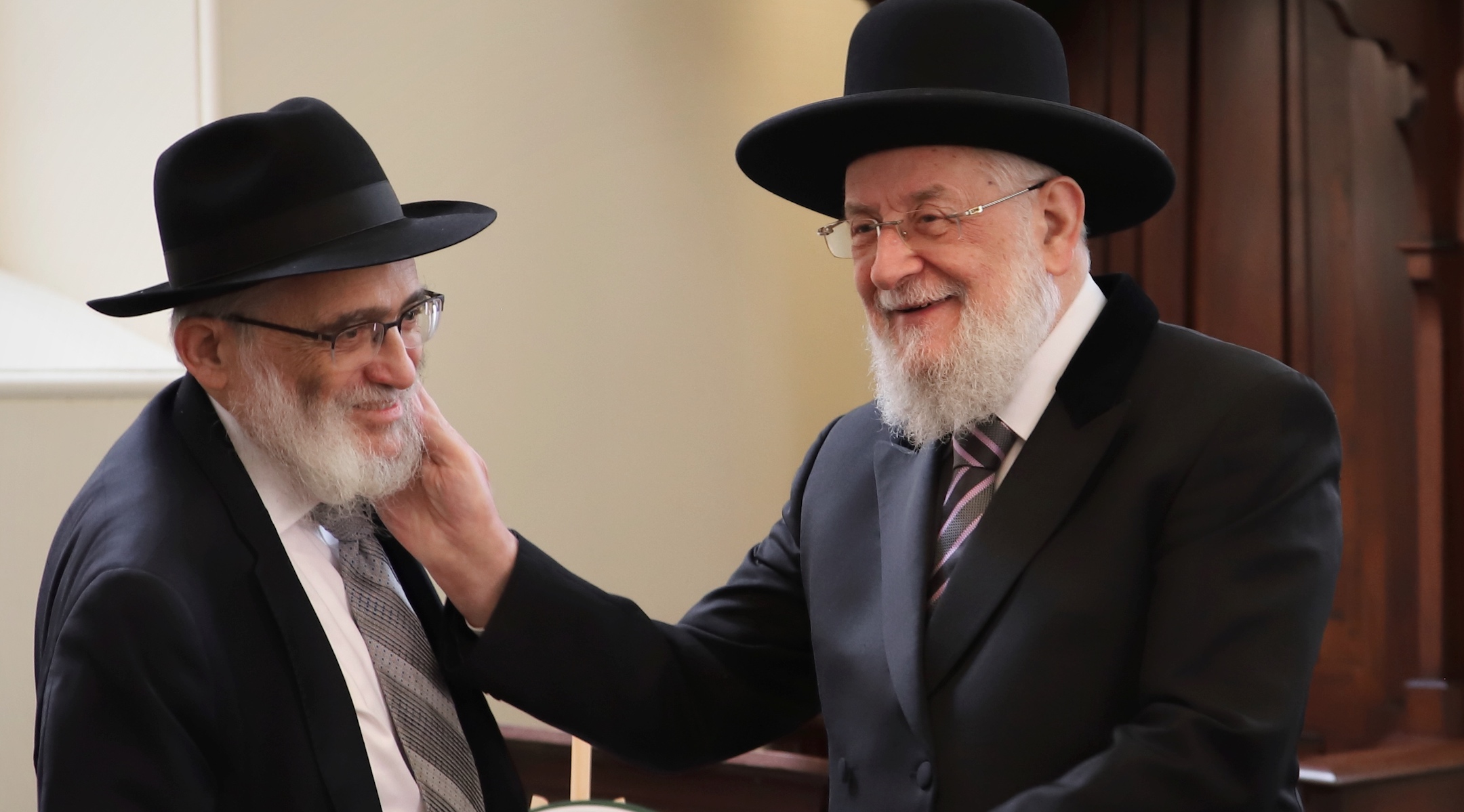 Lau shown with Joseph Gutnick, left, a mining magnate who is funding a renovation of the synagogue. (Mishka Gora)