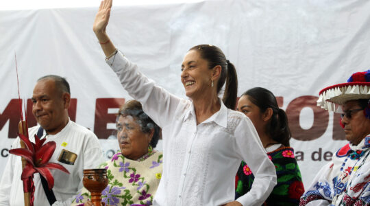 Claudia Sheinbaum greets supporters during a rally