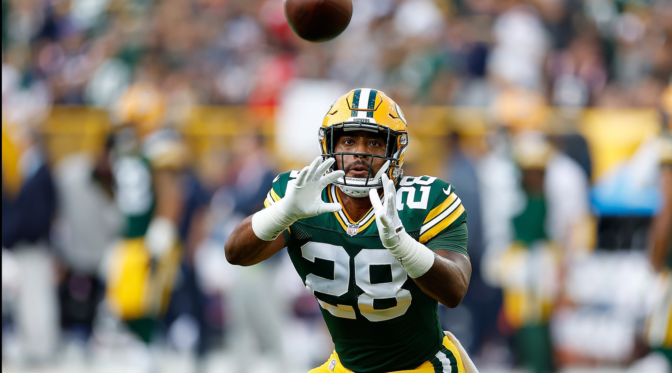 A.J. Dillon warms up before a preseason game against the New England Patriots at Lambeau Field in Green Bay, Wis., Aug. 19, 2023. (John Fisher/Getty Images)