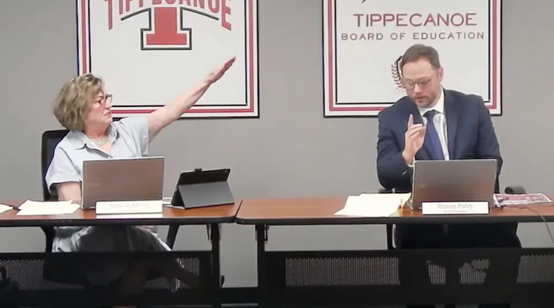 A school board member giving a Nazi salute