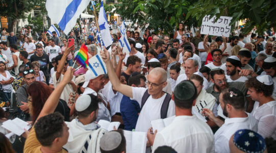 Clashes ensue during an Orthodox Yom Kippur prayer service at Dizengoff Square in Tel Aviv on September 25, 2023. (Itai Ron/Flash90)