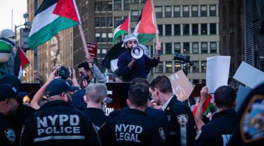 Police separate Israel supporters and pro-Palestinian demonstrators in Times Square, New York City, October 13, 2023. (Luke Tress)