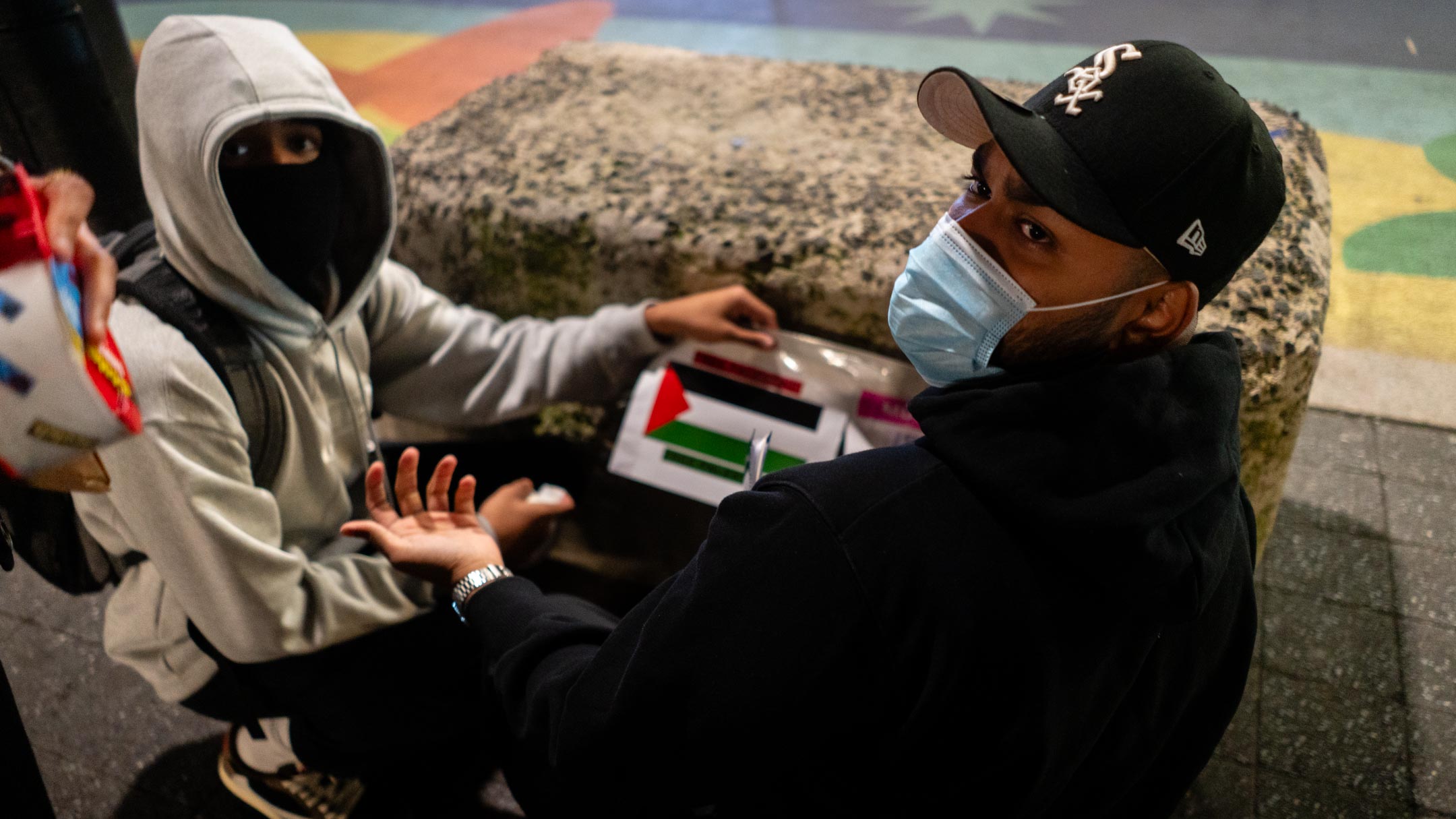 Pro-Palestinian activists put up posters near New York City's Union Square subway station, October 16, 2023. (Luke Tress)