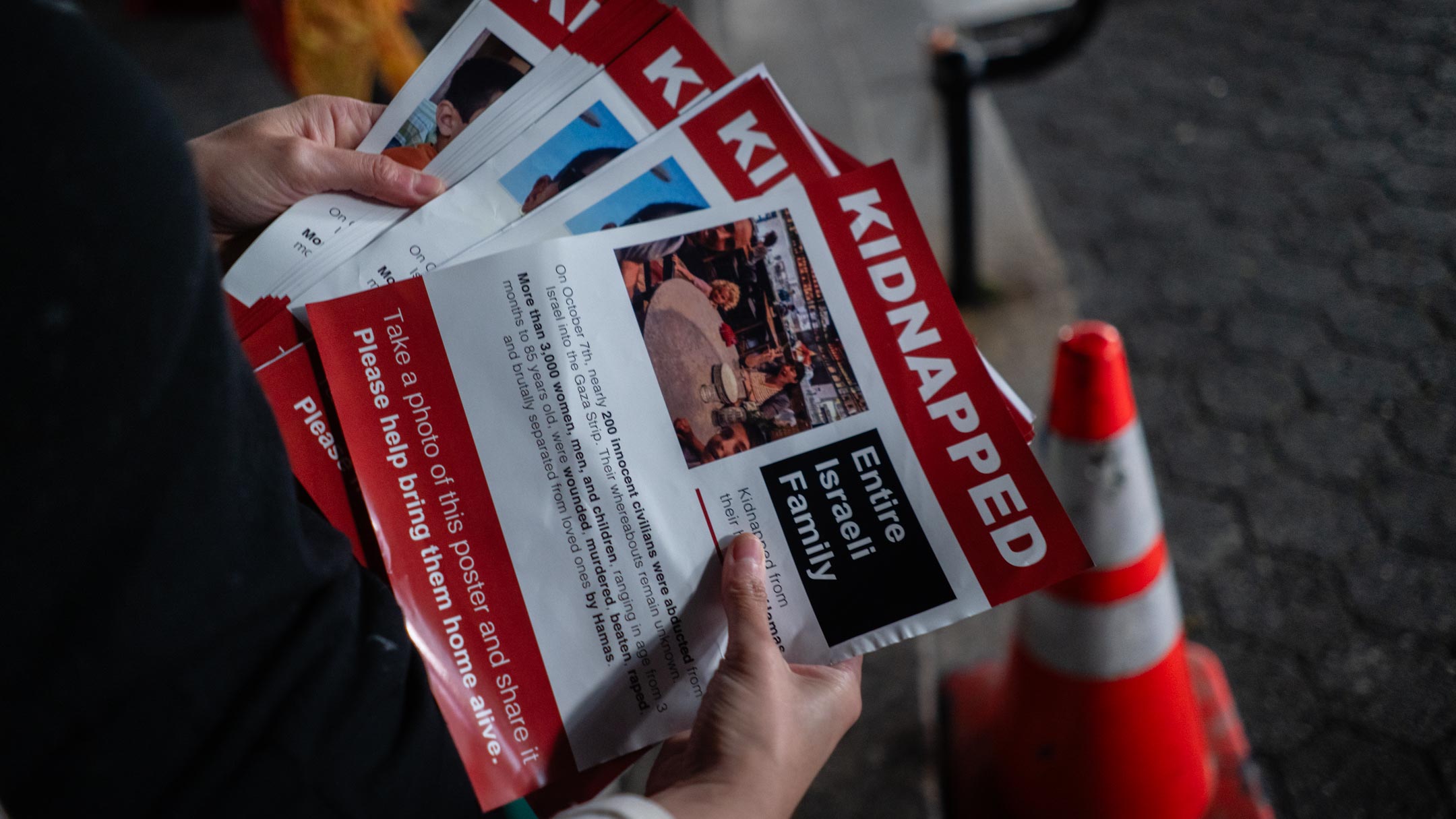 An Israeli activist prepares to put up posters near New York City's Union Square subway station, October 16, 2023. (Luke Tress)