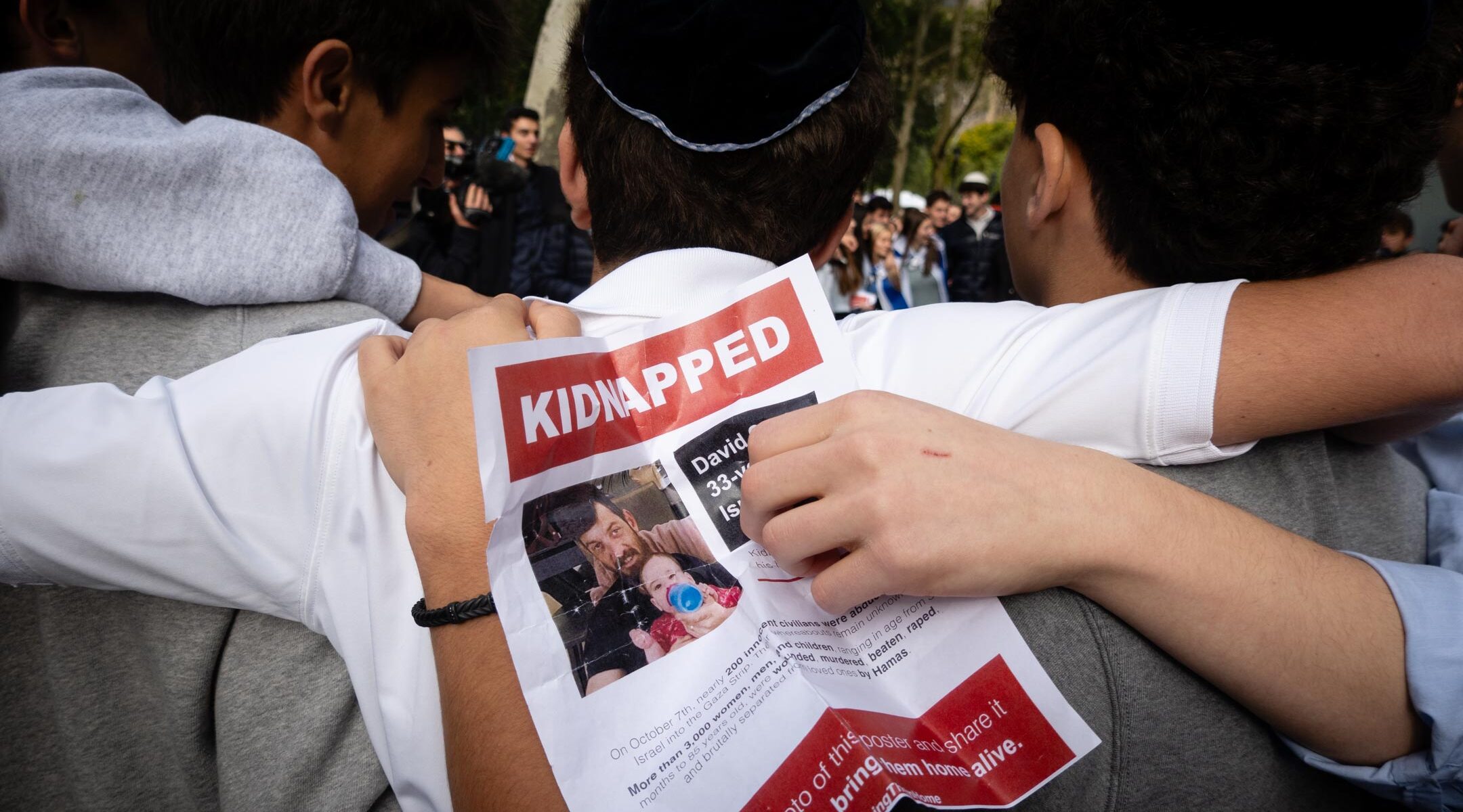 Students hold images of Israeli hostages held by Hamas at a rally demanding their release, in New York City, October 18, 2023. (Luke Tress)