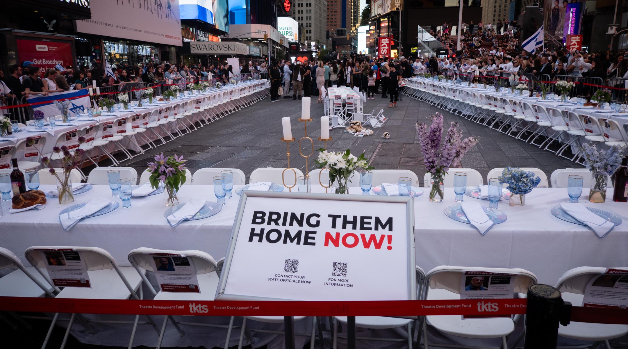 An empty shabbat table symbolizing the over 200 hostages held by Hamas in Gaza, in Times Square, New York City, October 27, 2023. (Luke Tress)