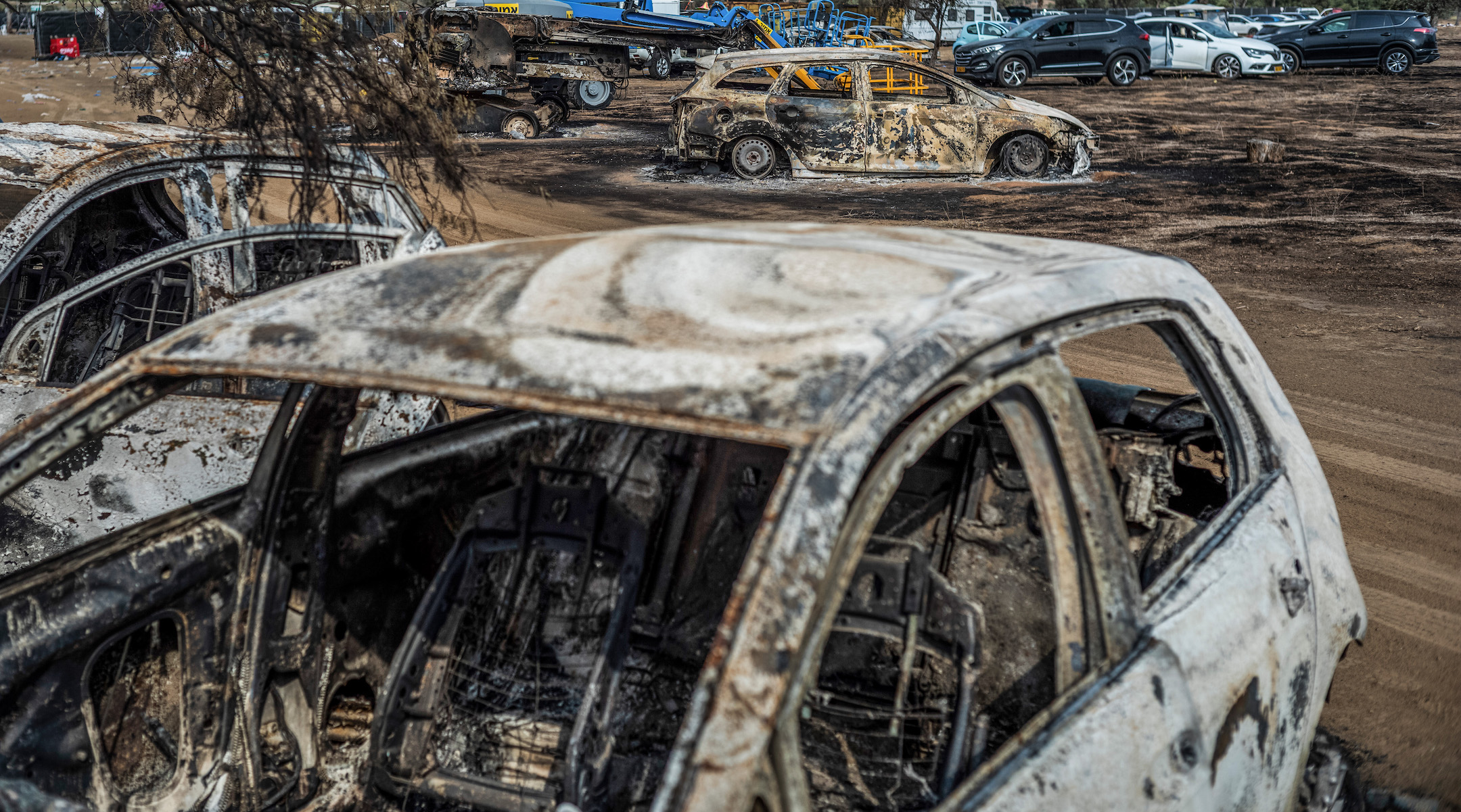 A view of destroyed vehicles near the grounds of the Tribe of Nova music festival after Saturday's deadly attack by Hamas (Ilia Yefimovich/picture alliance via Getty Images)