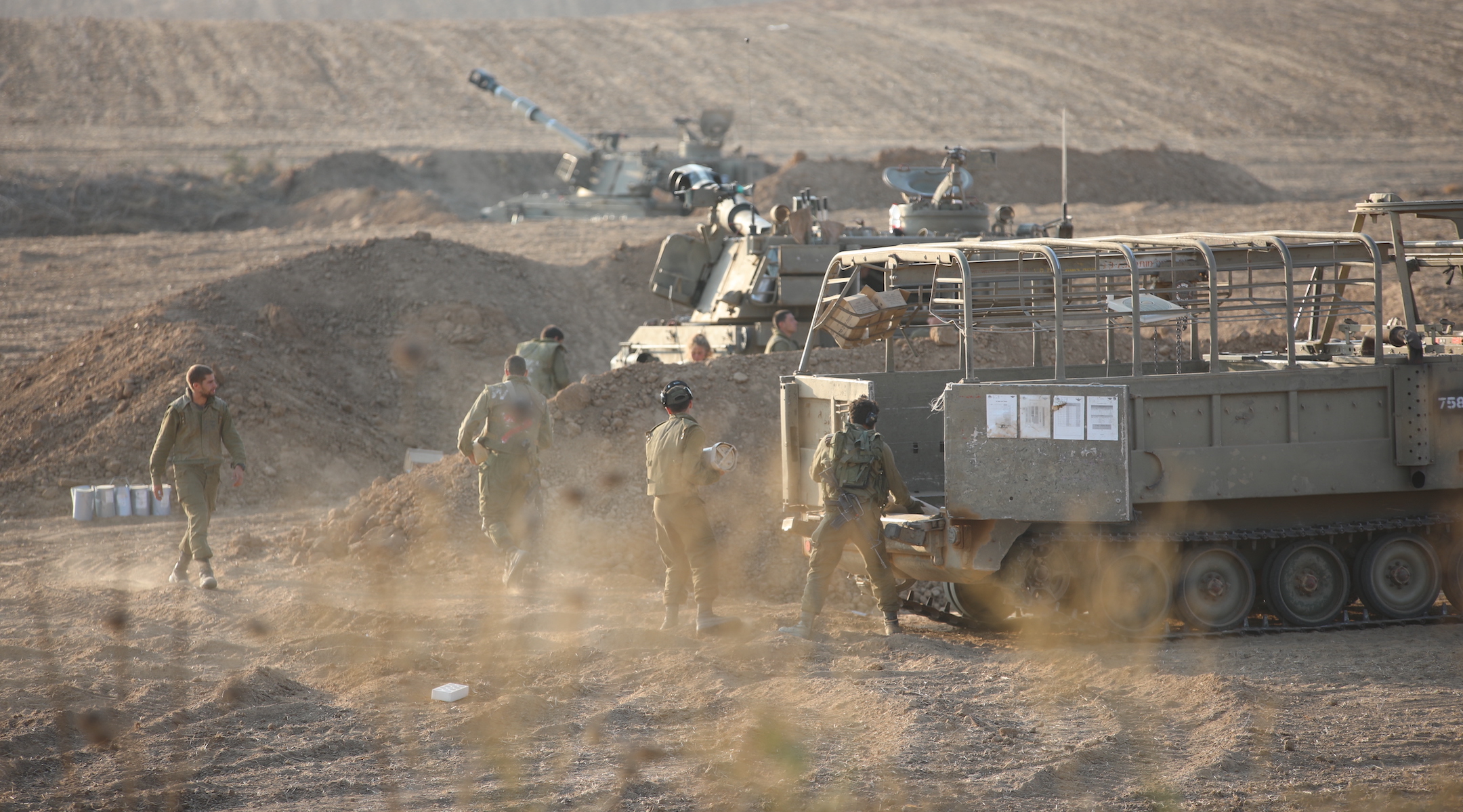 Israeli troops and armored vehicles near the Gaza border in Sderot on October 14, 2023. (Metin Yuksel Kaya/Anadolu via Getty Images)