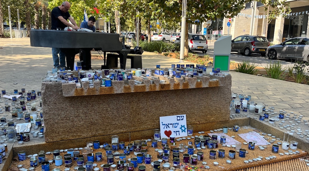 A makeshift memorial on a boulevard in Modiin, Israel, for those killed in Hamas' attack that began on Oct. 7, 2023. (Uriel Heilman)