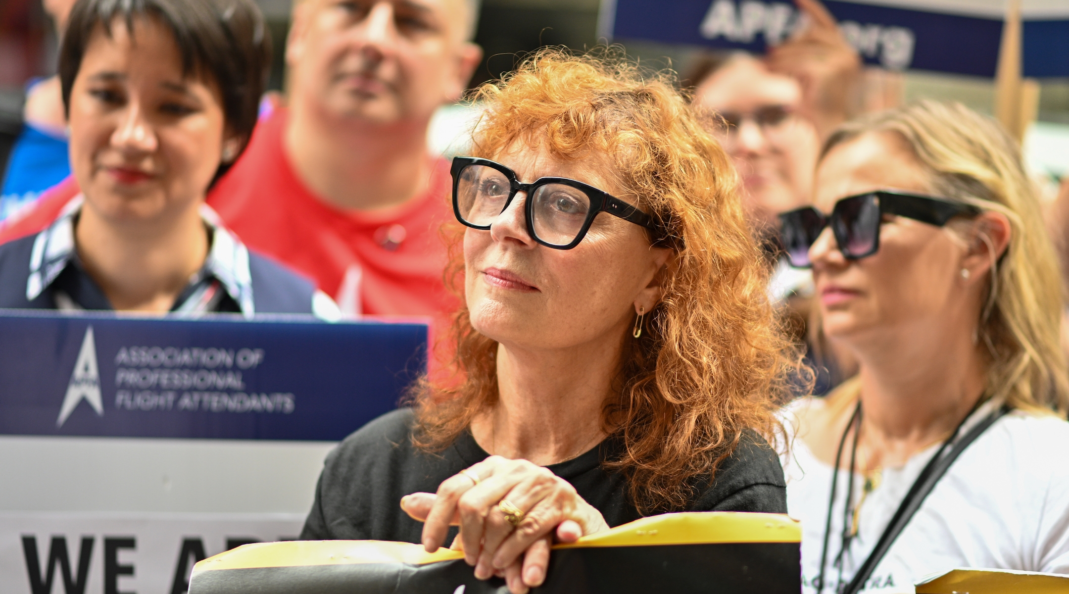 Susan Sarandon listening on a SAG-AFTRA picket line