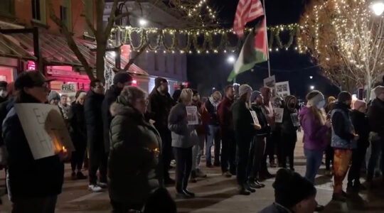 Demonstrators gather at a vigil for Palestinian victims of a shooting in Vermont