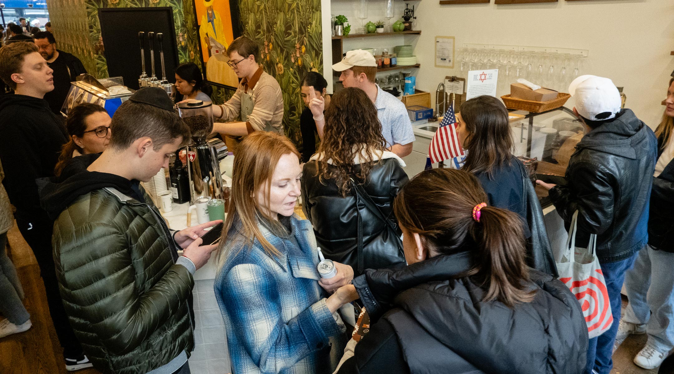 Customers pack into Caffe Aronne in the Upper East Side after staff members quit due to the store's pro-Israel activities, Nov. 7, 2023. (Luke Tress)