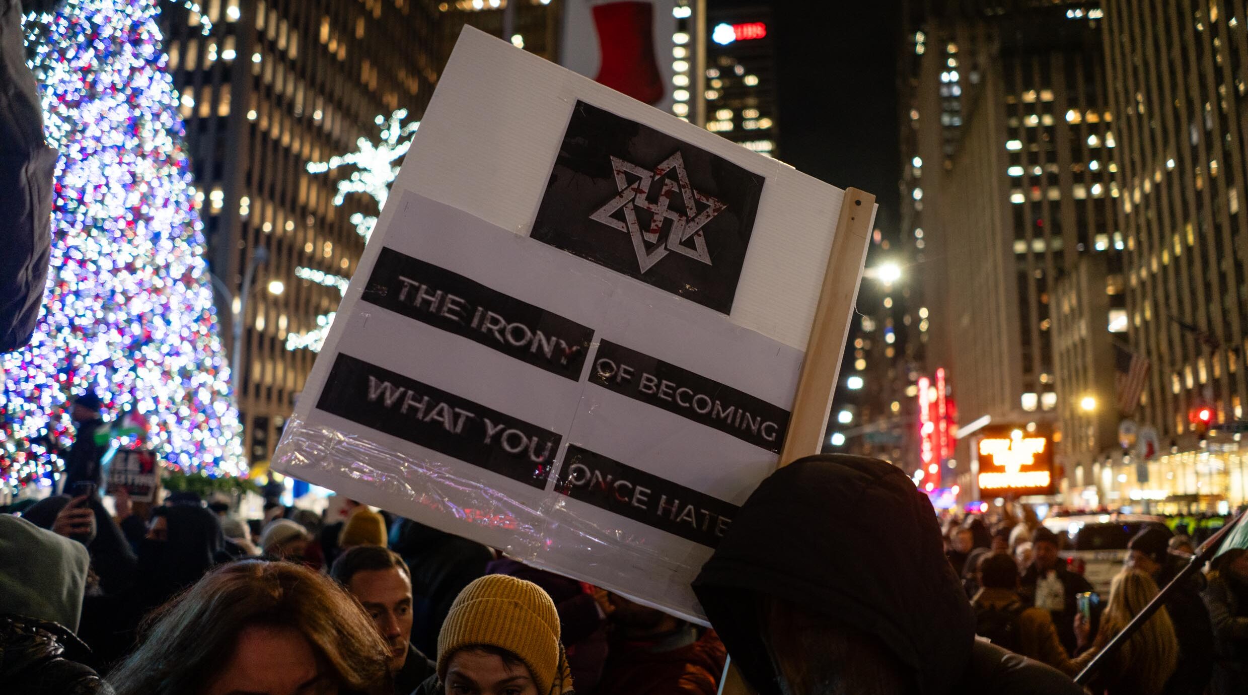 Anti-Israel demonstrators hold a rally against the Rockefeller Christmas tree lighting, in New York City, November 29, 2023. (Luke Tress)