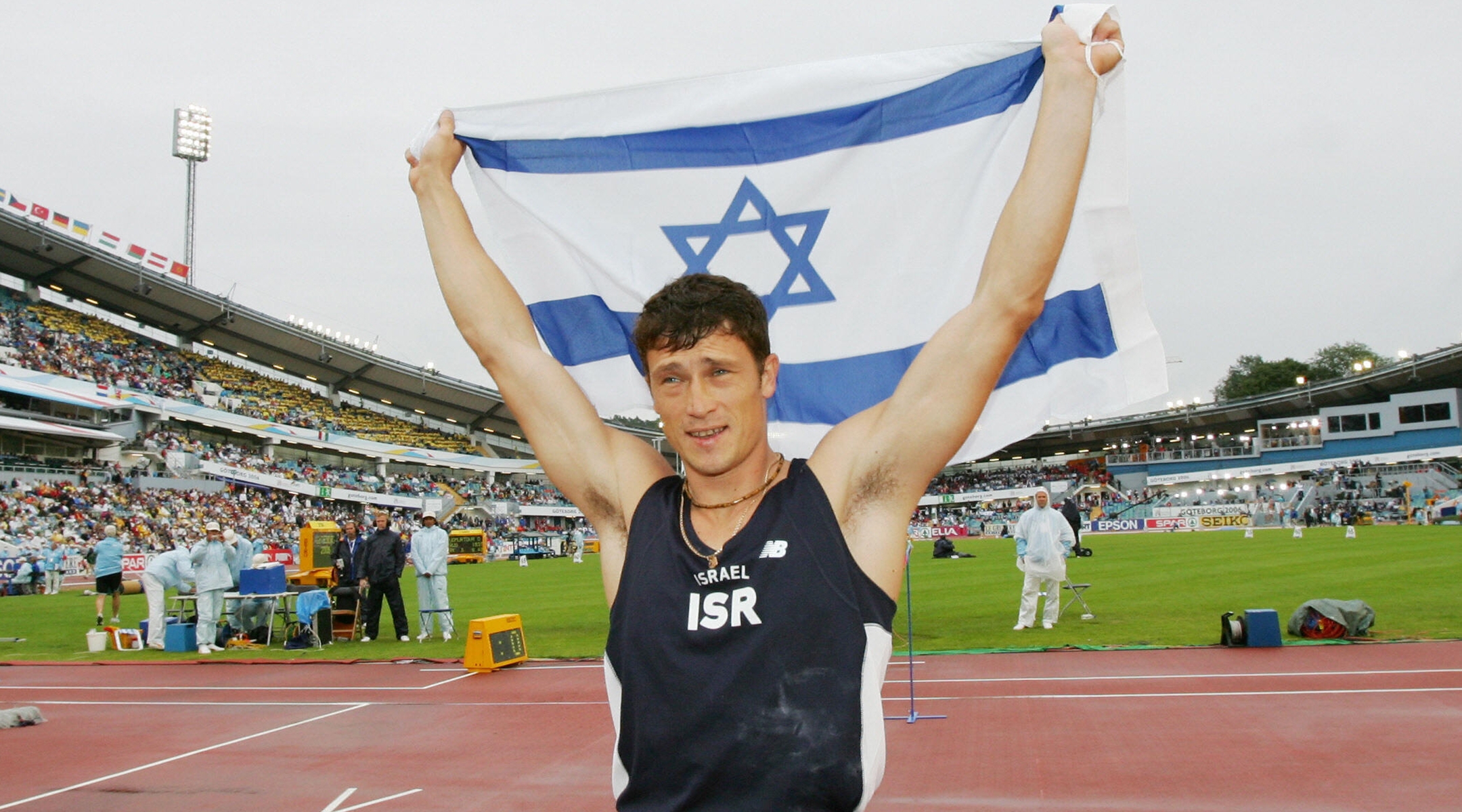 Alex Averbukh with an Israeli flag