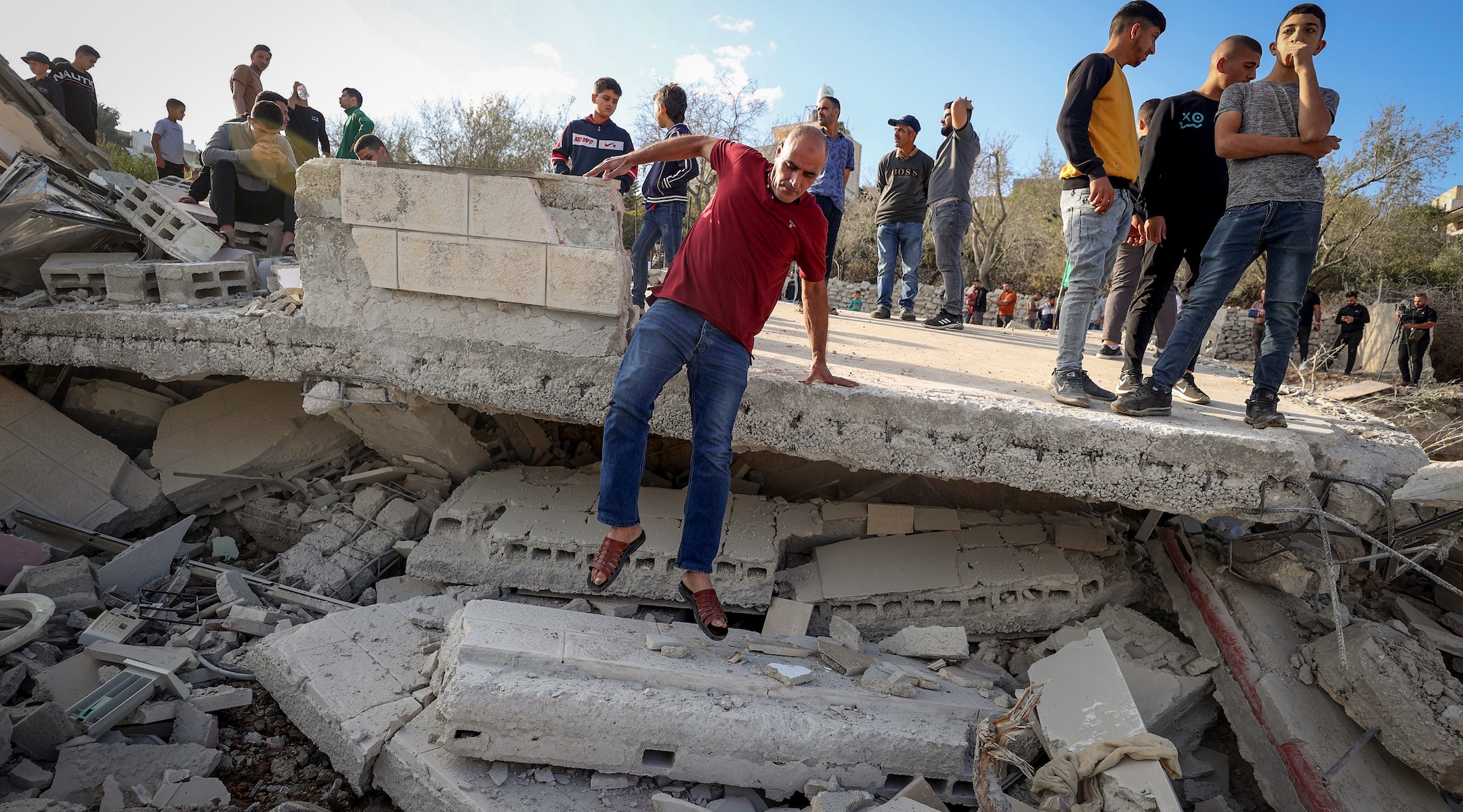 Palestinians inspect the demolished family home of Saleh al-Arouri, in the West Bank village of Arura, near Ramallah, on October 31, 2023.(FLASH90)