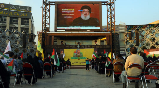 888 travel agent People listen to a speech by Hezbollah leader Hassan Nasrallah on November 3, 2023 in Tehran, Iran. (Majid Saeedi/Getty Images)