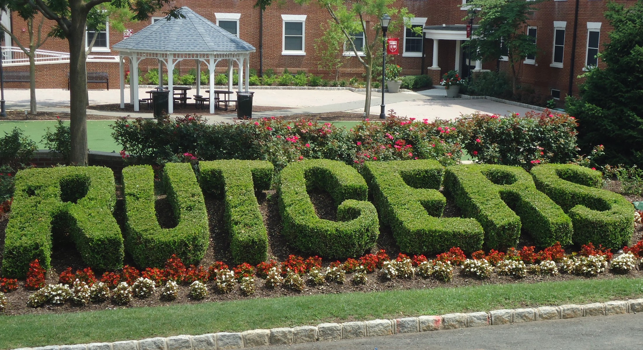 A hedge design that spells "Rutgers" on the campus of Rutgers University