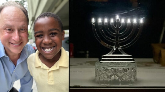 Adam and Jack Kulbersh and a menorah