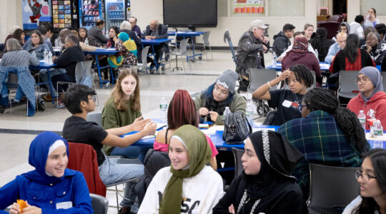 A diverse group of high school students meets to talk about contentious issues
