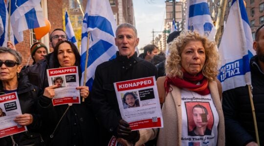 Left wing Israeli leader Yair Golan alongside protesters outside the home of U.N. Secretary-General Antonio Guterres, December 8, 2024. (Luke Tress)