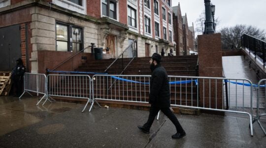 Police block the entrance to the main synagogue of Chabad headquarters due to safety concerns, Jan. 9, 2024. (Luke Tress)