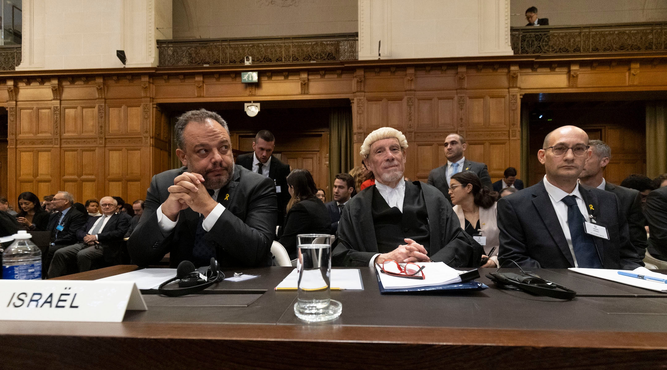 Israeli legal counsellor Tal Becker, barrister Malcolm Shaw, and Gilad Noam wait for hearings at the International Court of Justice at the Hague, Netherlands on Jan. 12, 2024. (Michel Porro/Getty Images)