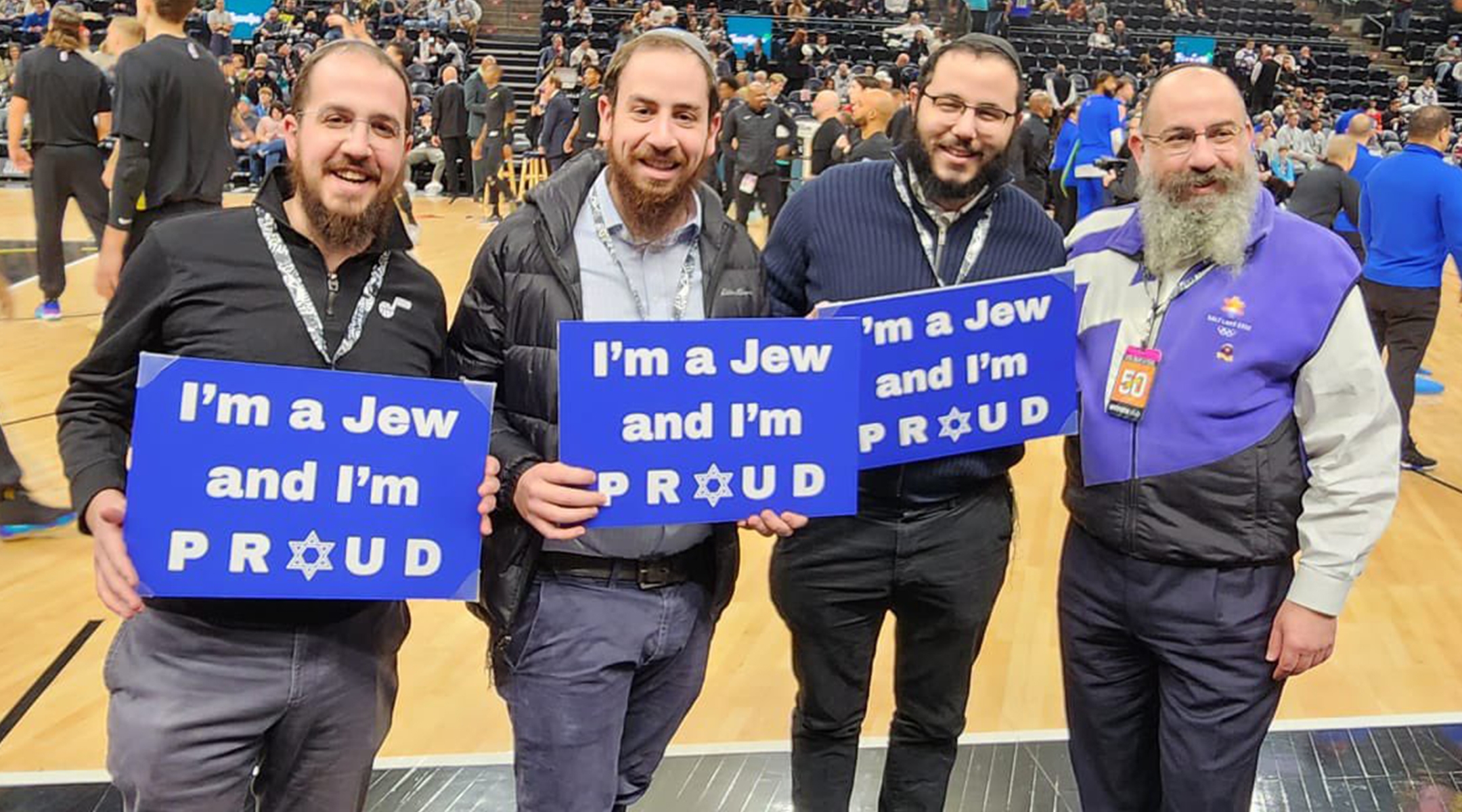Rabbis holding signs saying "I'm a Jew and I'm proud"