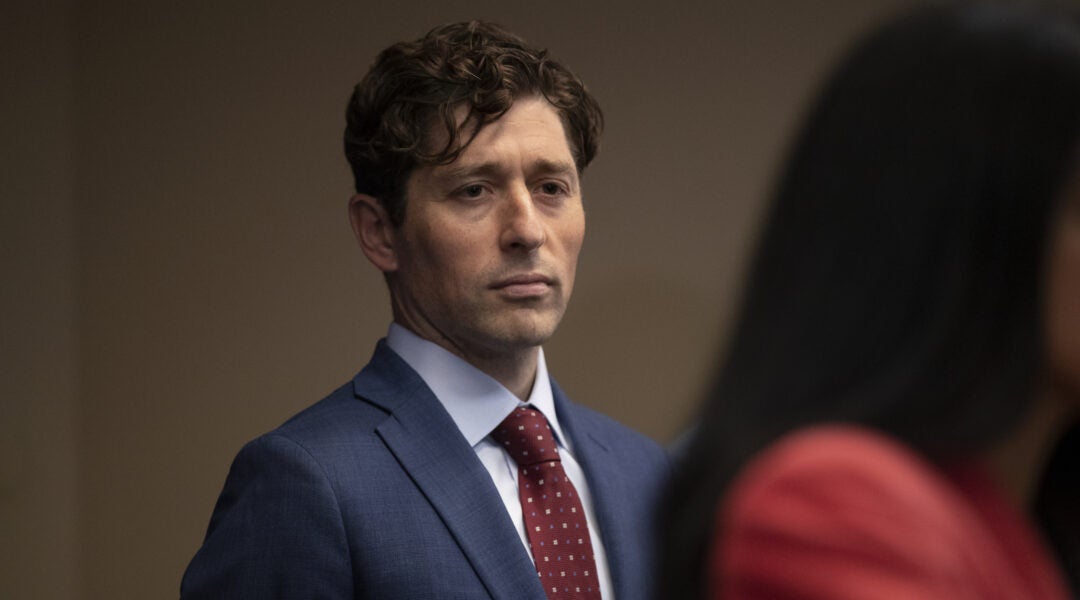 Minneapolis Mayor Jacob Frey looks on during a press conference