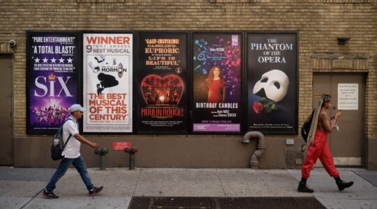Posters advertise Broadway musicals outside the Richard Rodgers Theatre near Times Square in New York on September 14, 2021. (Photo by ED JONES/AFP via Getty Images)