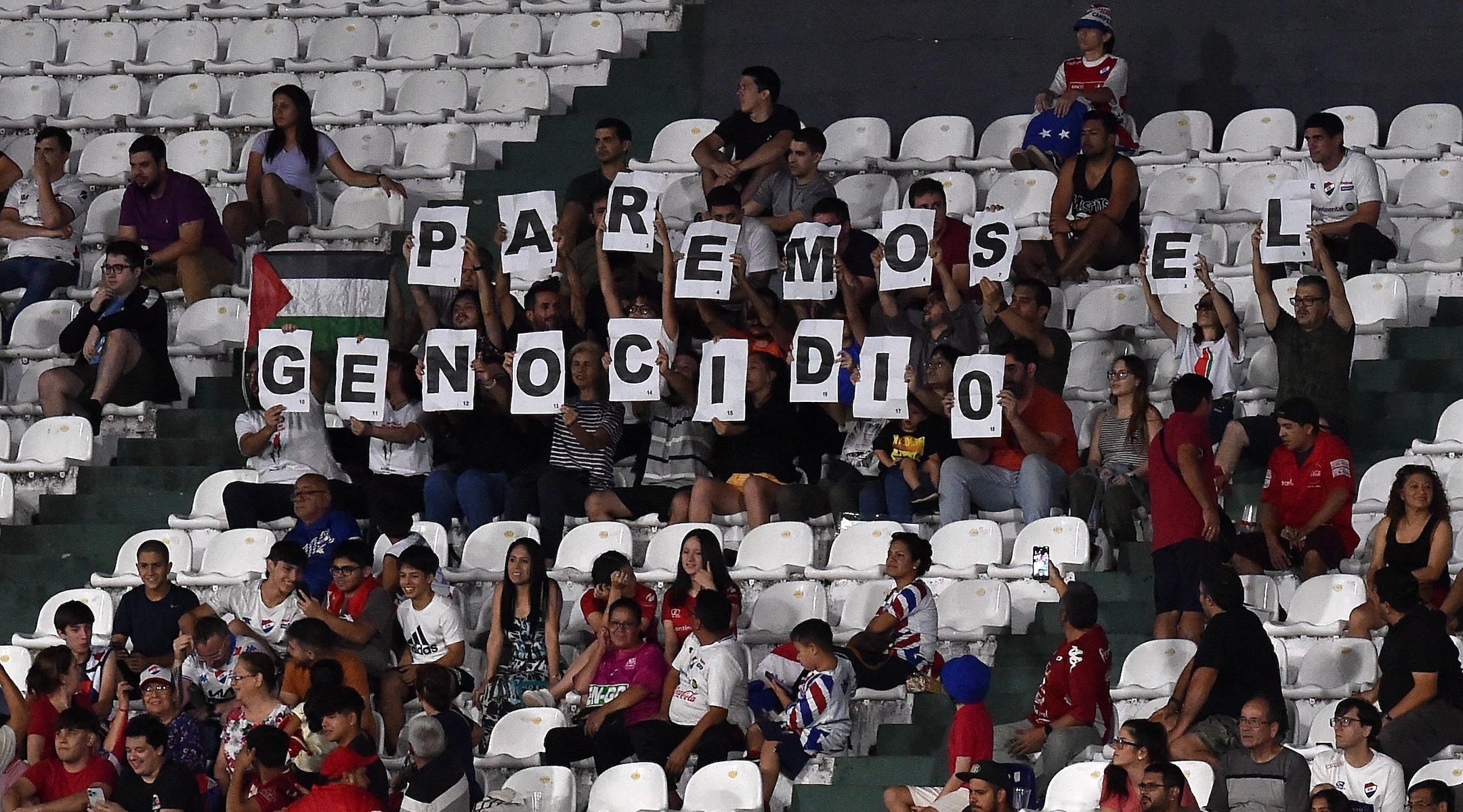 Fans holding a sign