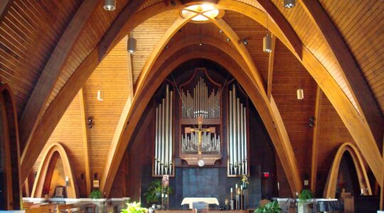 A large empty chapel with ornate architecture