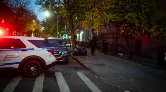 Illustrative: NYPD vehicles in a religious neighborhood in Brooklyn, November 6, 2022. (Luke Tress)