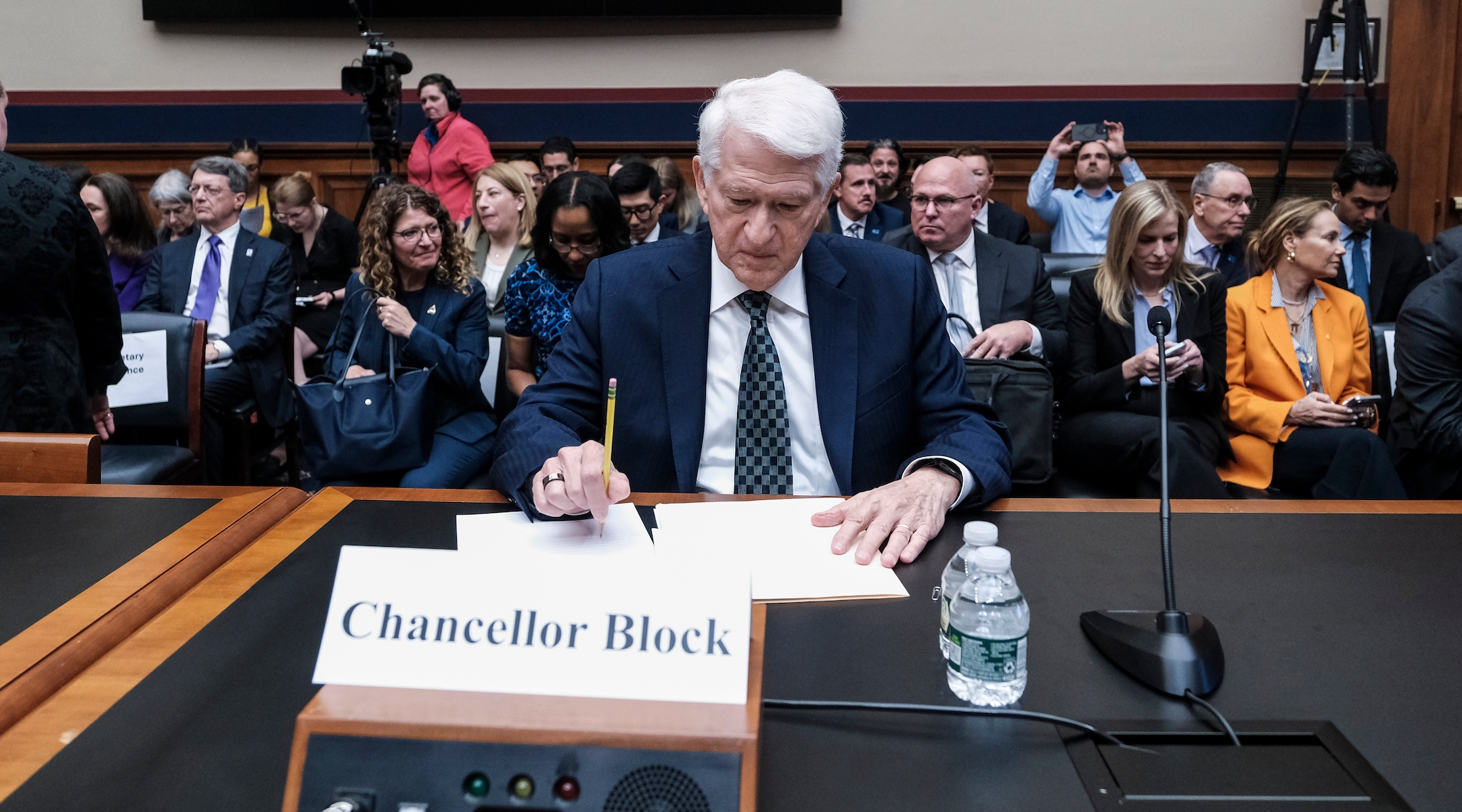 A university chancellor testifies before a Congressional hearing.