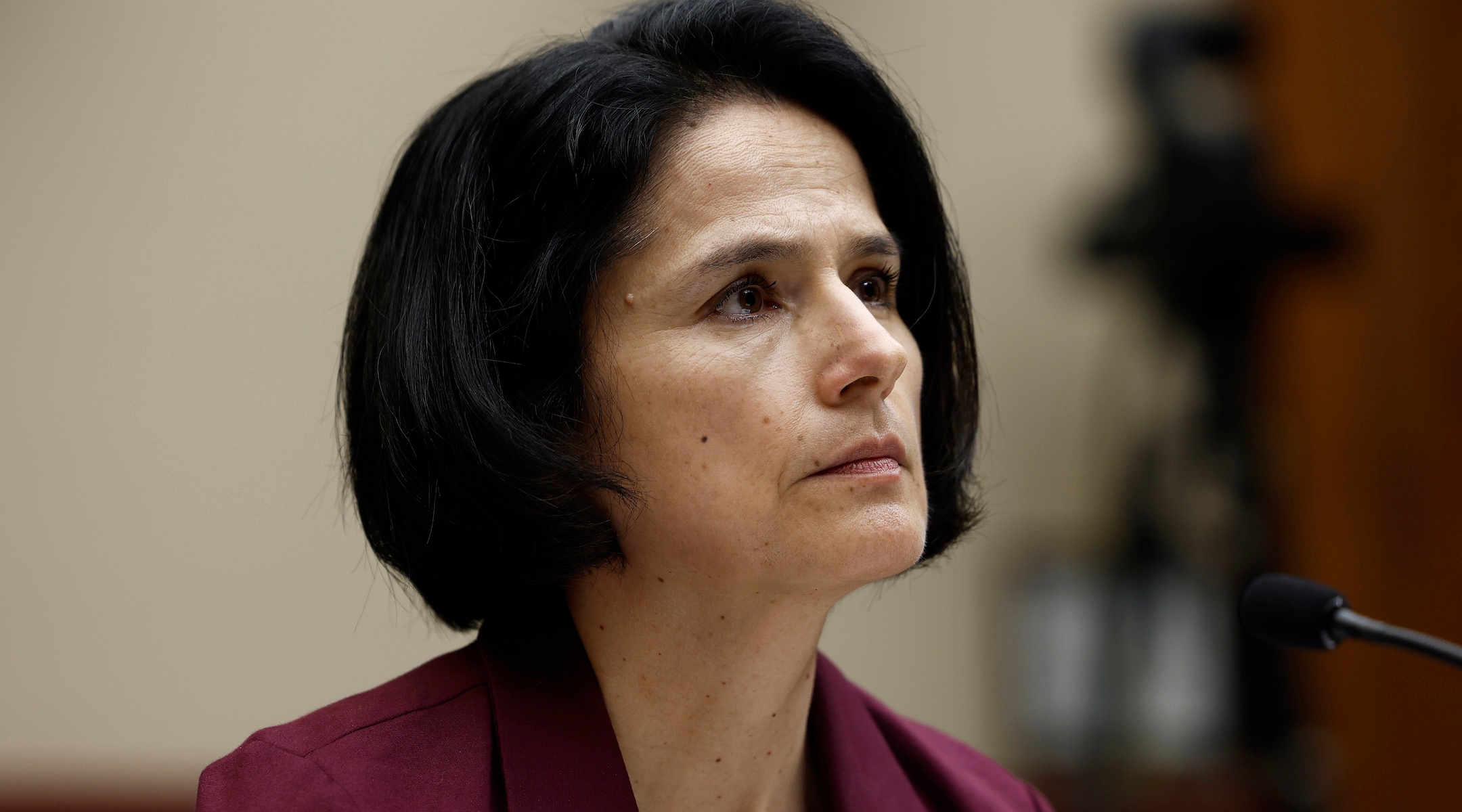 An education board president listens during a Congressional hearing