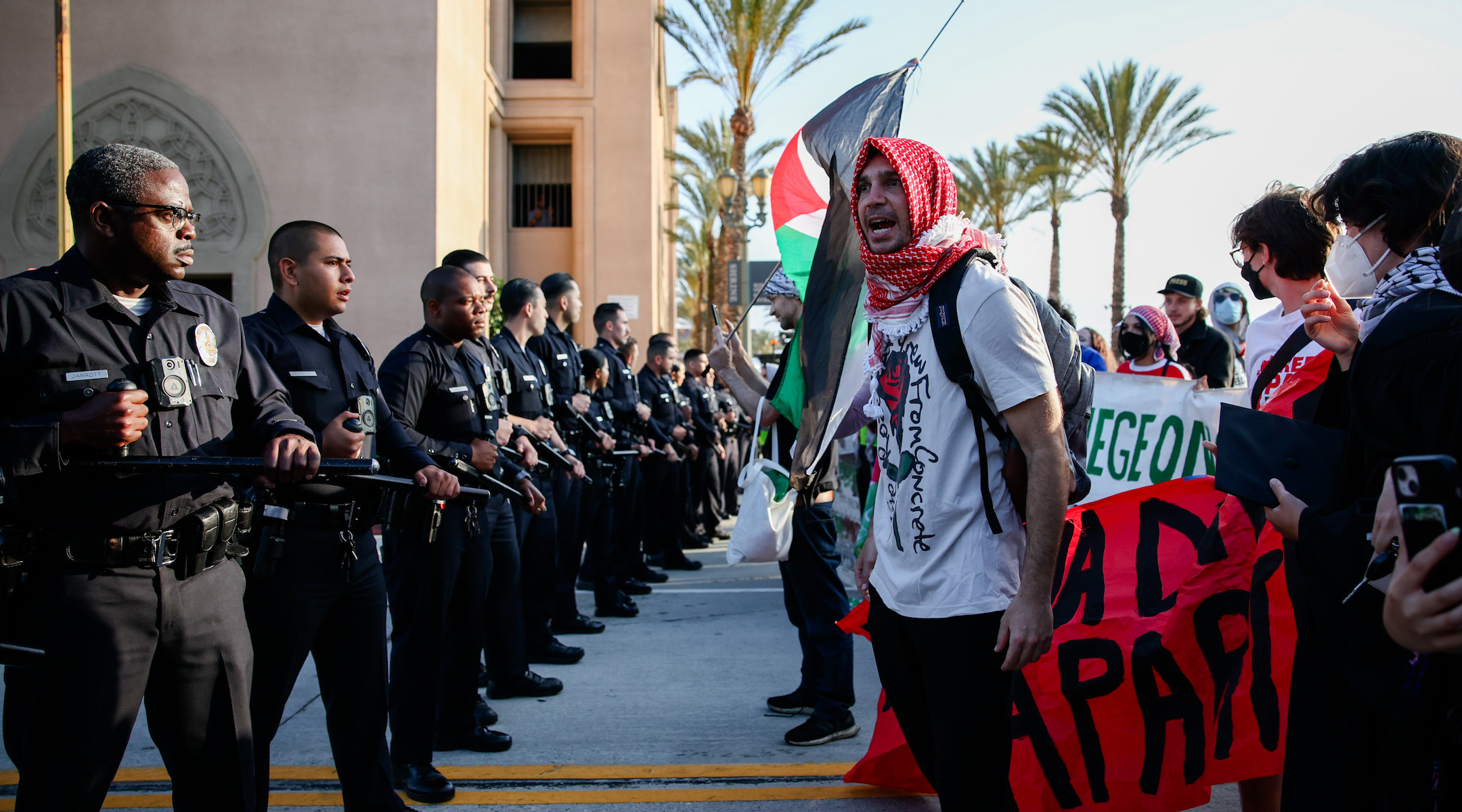 Protesters confront police