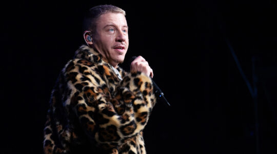 Macklemore performs onstage in Seattle in December. (Mat Hayward/Getty Images)