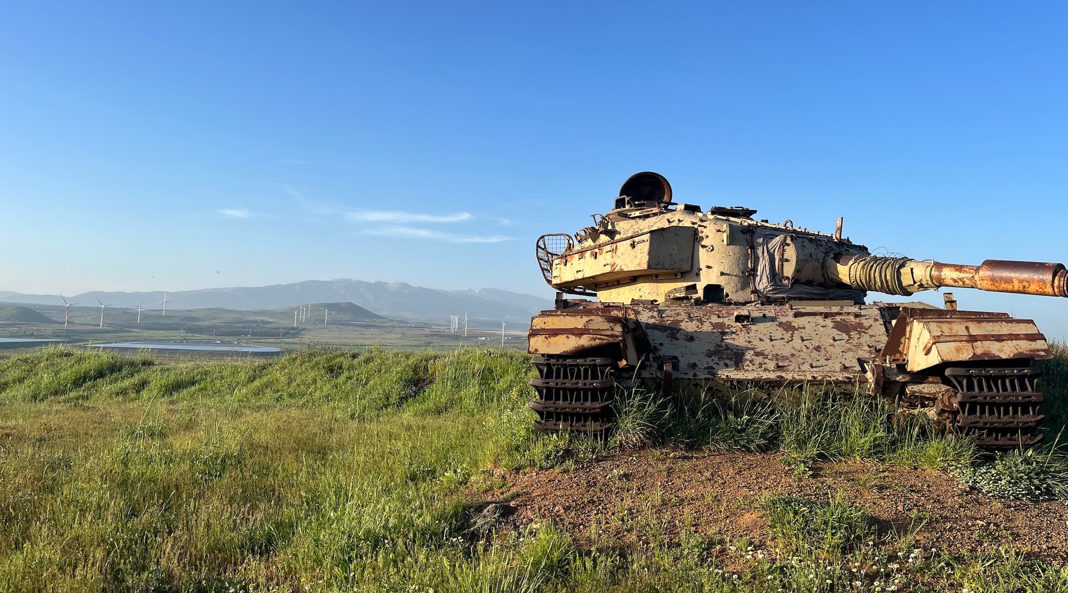 A rusting tank on a hill in the Golan Heights overlooking Syria is a vestige of an earlier war. The area last saw serious fighting during the 1973 Yom Kippur War. (Uriel Heilman)
