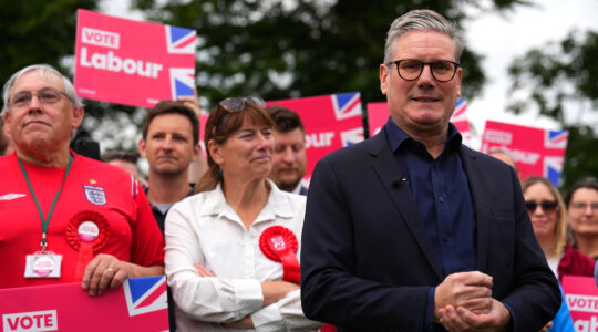 Labour Leader Sir Keir Starmer poses for photographers after delivering a stump speech at Hitchin Town Football Club on July 1, 2024 in Hitchin, England. (Carl Court/Getty Images)
