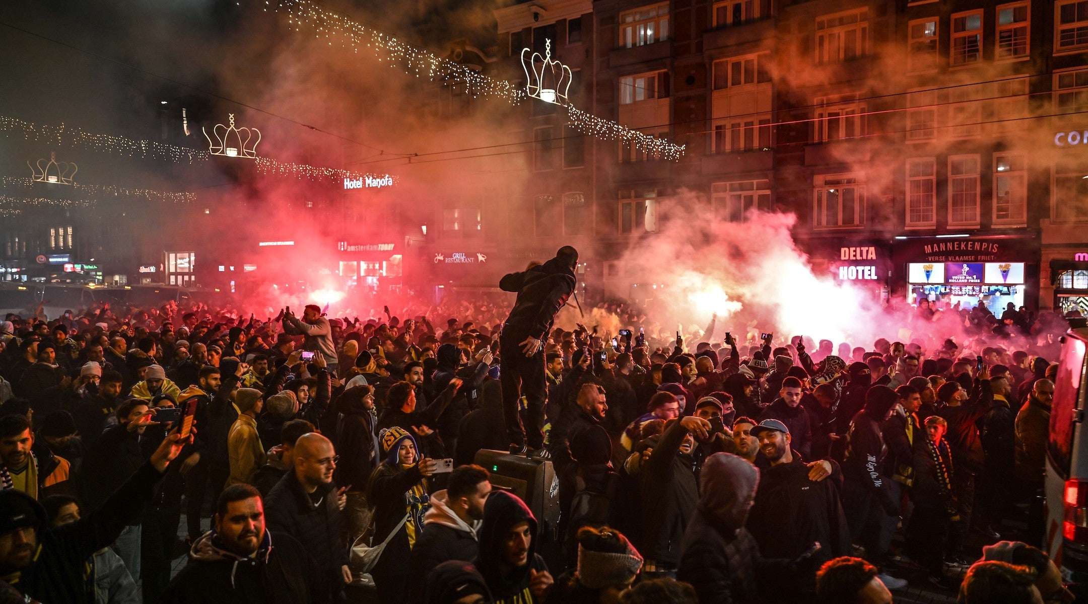 Fans of Maccabi Tel Aviv stage a pro-Israel demonstration at the Dam Square on Nov. 7, lighting up flares and chanting slogans ahead of the match between Maccabi Tel Aviv and Ajax. (Mouneb Taim/Anadolu via Getty Images)