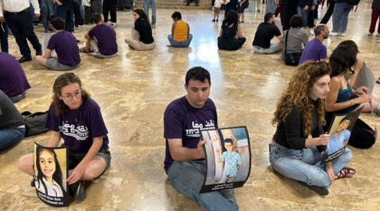 Activists with the group Standing Together hold a silent protest at the University of Haifa in April 2025. (Alma Barski)