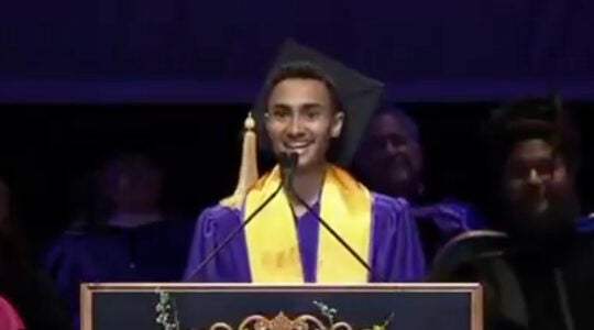 A student commencement speaker delivering an address