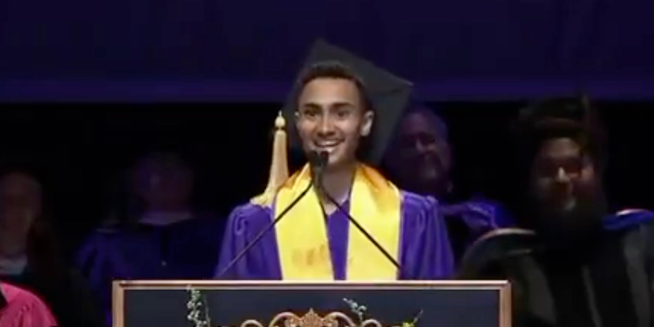 A student commencement speaker delivering an address