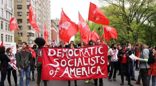 Members of the Democratic Socialists of America gather outside of a Trump owned building on May Day, 2019 in New York City. (Spencer Platt/Getty Images)