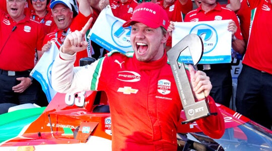 IndyCar driver Robert Shwartzman poses for a group photo with his team after winning the pole award as the fastest qualifier for the 109th running of the Indianapolis 500 on May 18, 2025, at the Indianapolis Motor Speedway in Indianapolis, Indiana. (Brian Spurlock/Icon Sportswire via Getty Images)