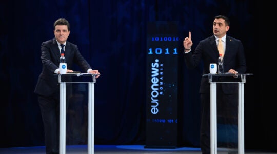 George Simion, left, during the live electoral debate with Pro-European independent presidential candidate and Bucharest Mayor Nicusor Dan in Bucharest, Romania, on May 8, 2025.