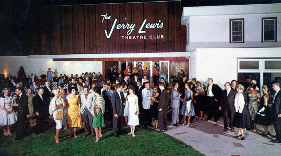 Hotel guests standing in front of The Jerry Lewis Theater Club